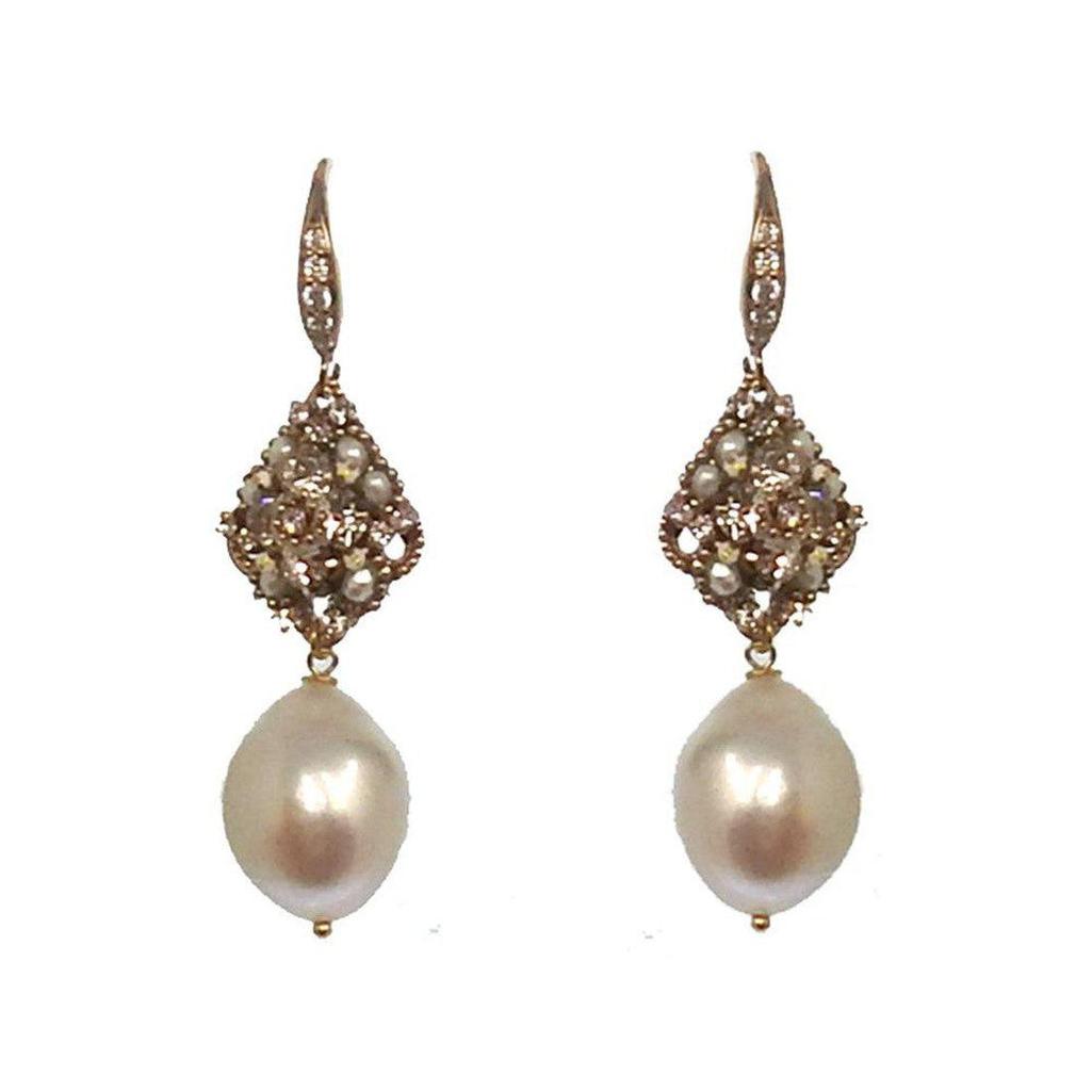 Baroque pearl drop earrings with rose gold diamond and pearl accents.
