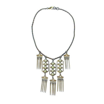 Beachcomber necklace: gold & bronze chain, off-white stones, geometric pendant with fringe accents.
