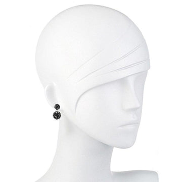 Black beaded double drop earrings on a mannequin.

