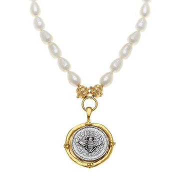 Bee Coin Pendant Necklace: Gold & silver bee coin pendant on a delicate pearl strand.
