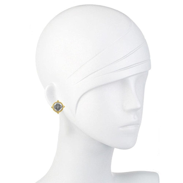 Intaglio bee design on gold-toned clip earrings, shown on a mannequin.
