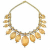 Gold Bette Davis Eyes necklace with amber stones and crystal accents.
