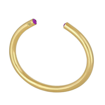 Gold bangle bracelet featuring small purple gemstones.
