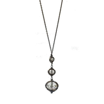 Black Diamond Rhodium Drop necklace: elegant, long chain with three clear crystal accents.
