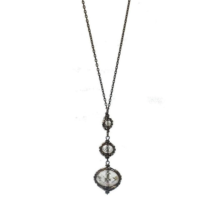 Black Diamond Rhodium Drop necklace: elegant, long chain with three clear crystal accents.
