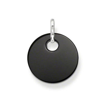 Black disc pendant with silver bail; minimalist jewelry.
