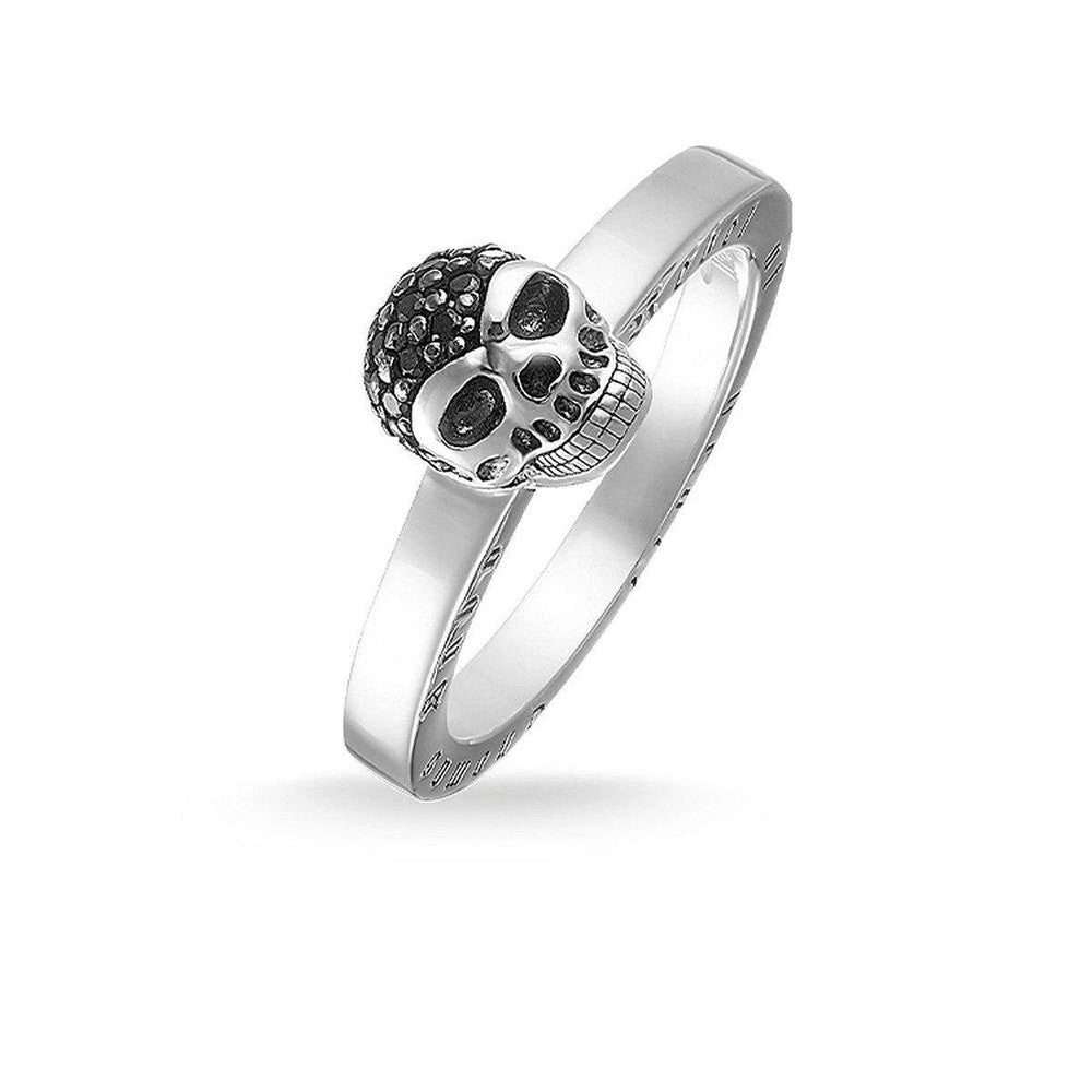 Silver skull ring, size 7, black cubic zirconia accents.
