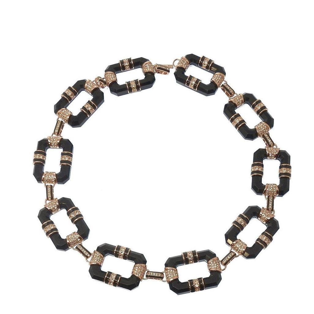 Black and rose gold link necklace with black onyx and clear cubic zirconia accents.
