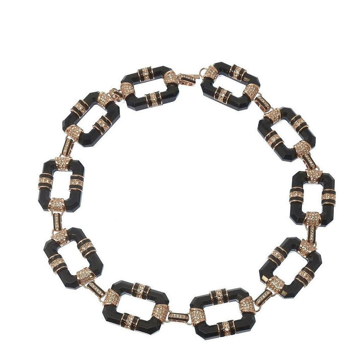 Black and rose gold link necklace with black onyx and clear cubic zirconia accents.
