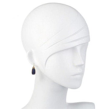 Deep blue sapphire and diamond drop earrings on a mannequin, 18k gold.
