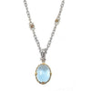Elegant blue topaz pendant necklace with silver chain and gold accents.
