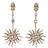 Blue Topaz and Pearl Sunburst earrings:  Gold, sunburst design with blue topaz and pearls.
