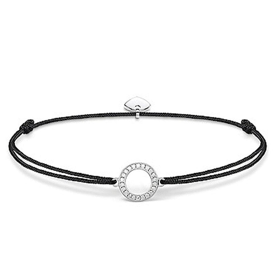 Black cord bracelet with a circular, silver charm adorned with sparkling stones.
