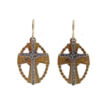 Bronze and silver cross earrings with intricate detailing.
