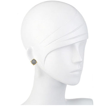 Gray buffalo coin stud earrings with gold accents, displayed on a mannequin.
