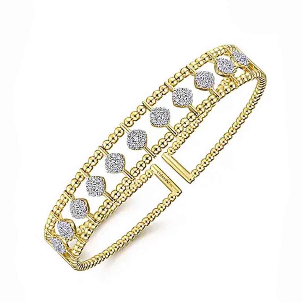 Gold Bujukan Cuff bracelet featuring diamond accents.
