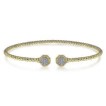 Gold beaded cuff bracelet featuring hexagon diamond accents.
