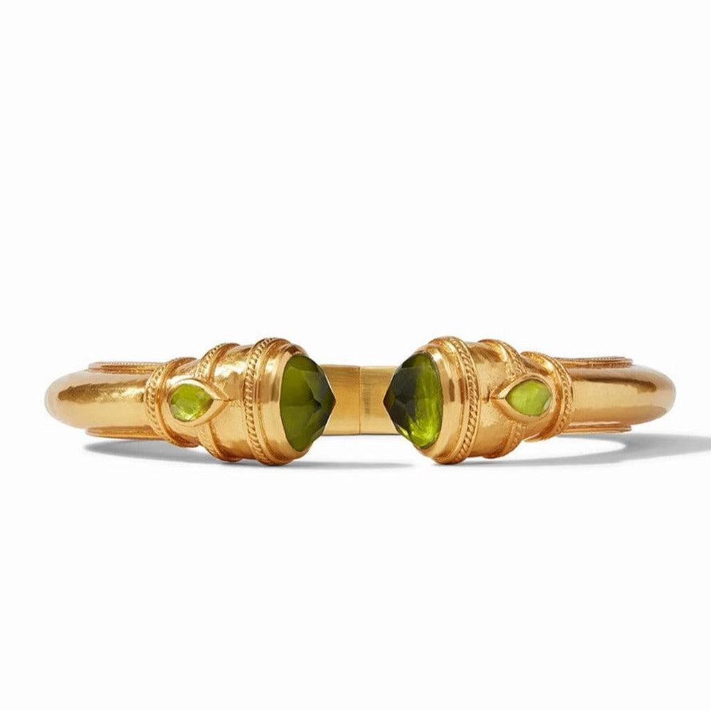 Gold Cannes Demi Hinge Cuff with green gemstones.

