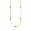 Casablanca Station Necklace: Gold chain necklace with four textured ball accents.
