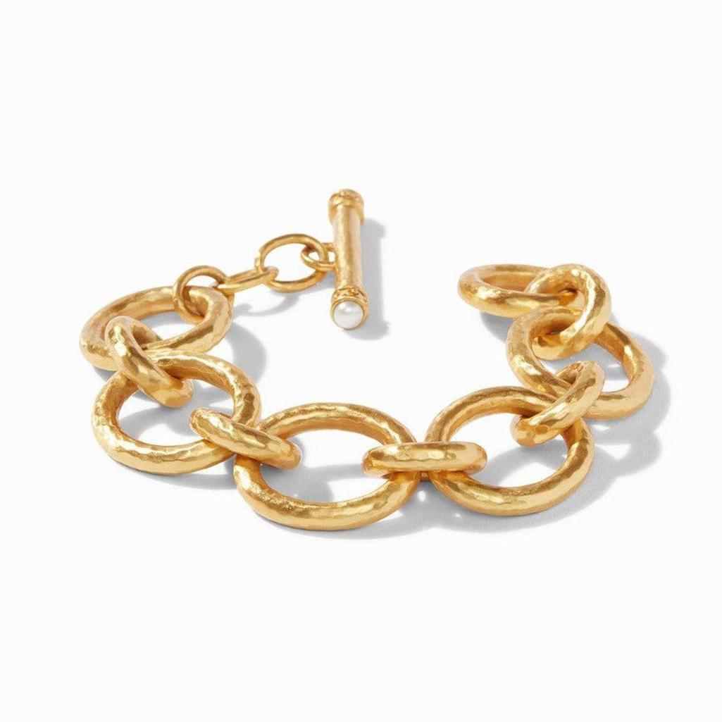 Gold Catalina Link bracelet with hammered texture and pearl detail.
