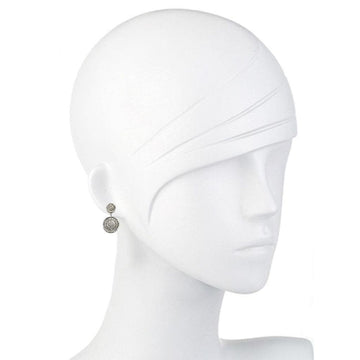 Double-circle pave diamond earrings on a mannequin.
