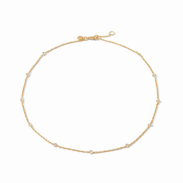 Gold chain necklace with small, clear stones; delicate design.
