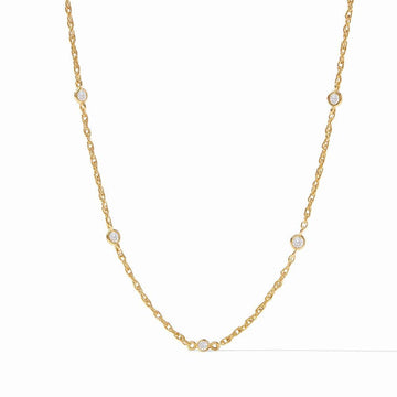 Celeste Delicate Station Necklace: Gold chain with five bezel-set diamonds.
