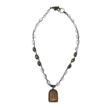 Elegant necklace featuring clear and pyrite beads, accented with an ornate gold pendant.
