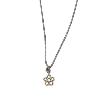 Dainty flower pendant necklace on a delicate chain.
