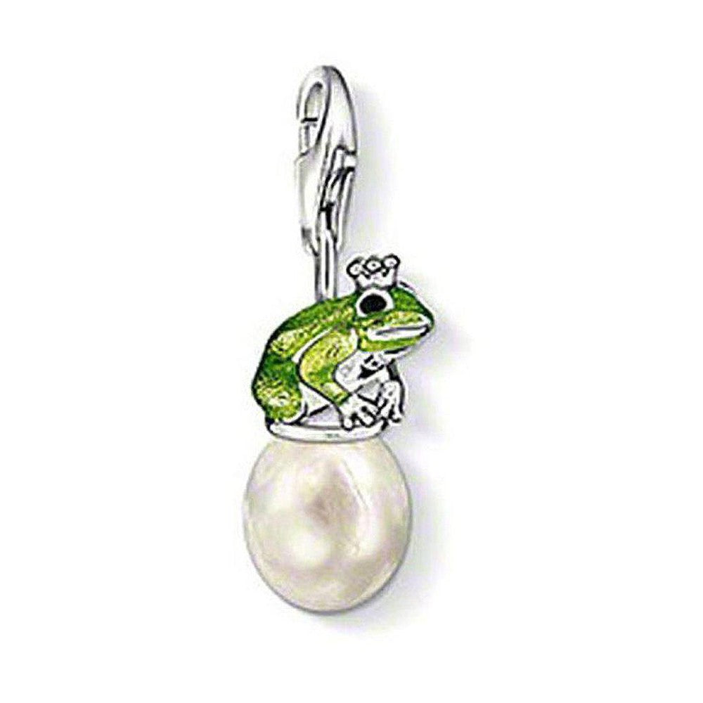 Green frog prince charm atop a pearl, silver setting.
