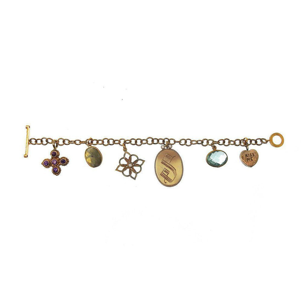 Bronze charm bracelet with amethyst and aquamarine accents.
