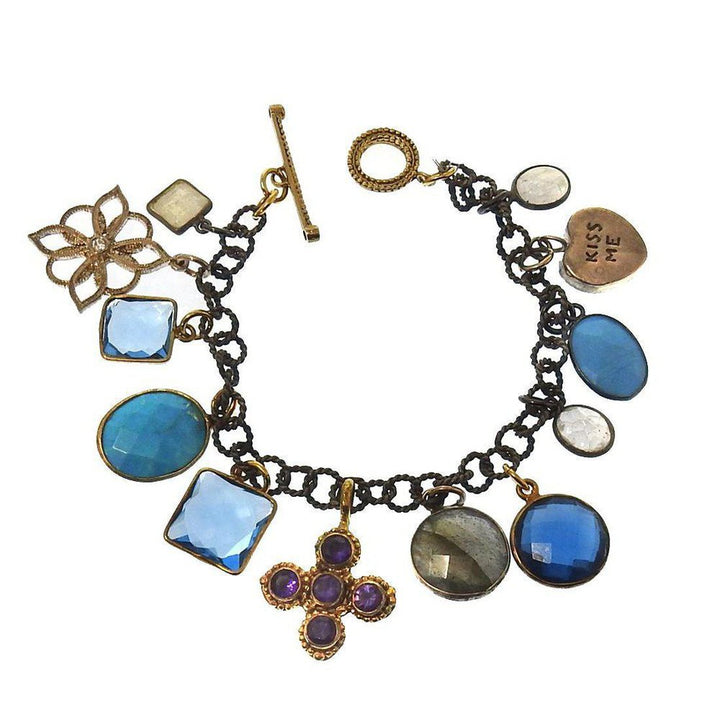 Charm Bracelet Blue Mood: Multi-gemstone charm bracelet with blue, purple & white stones, gold & bronze accents.
