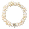 Elegant cream pearl charm bracelet with silver clasp
