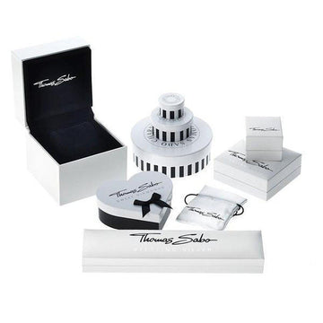 Elegant jewelry packaging in white and black, showcasing various box styles.
