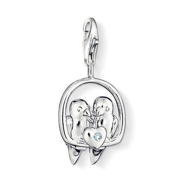 Charm DC0013 Lovebirds diamond charm: Silver-tone lovebirds pendant with a light blue heart-shaped diamond.
