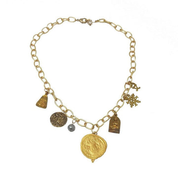 Gold chain necklace featuring multiple charms, including coins, a pearl, and religious symbols.
