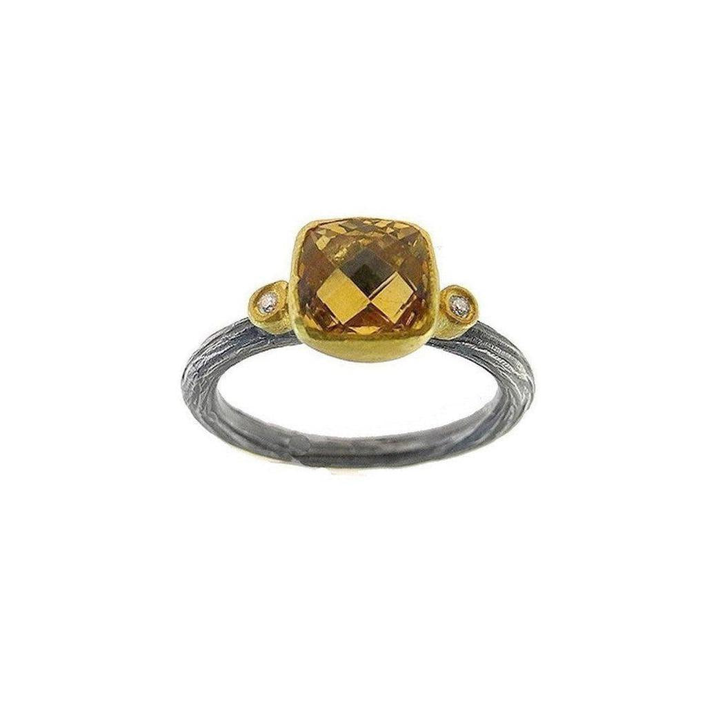 Citrine ring with diamond accents, gold and oxidized silver band.
