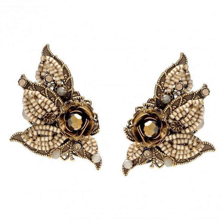 Antique gold beaded floral clip earrings with dark brown crystal accents.
