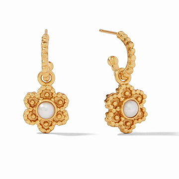 Gold hoop earrings with delicate flower charms and pearl accents.
