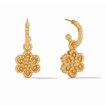 Gold hoop earrings with textured floral accents.
