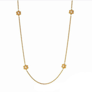 Gold Colette Pearl Station necklace featuring four floral accents with pearls.

