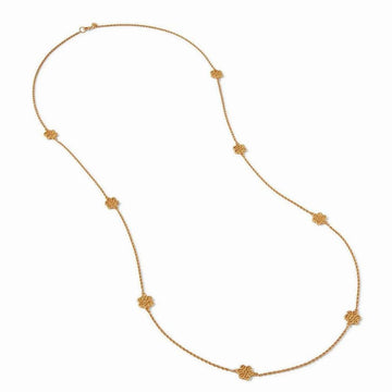 Gold long necklace featuring textured floral accents.
