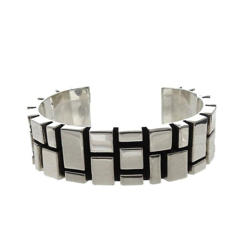 Contemporary sterling silver cuff bracelet with geometric block design.
