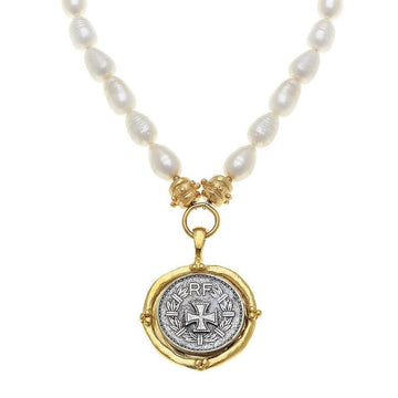 Cross Coin Pendant Necklace on Pearls: Rotating silver coin, gold frame, pearl strand.
