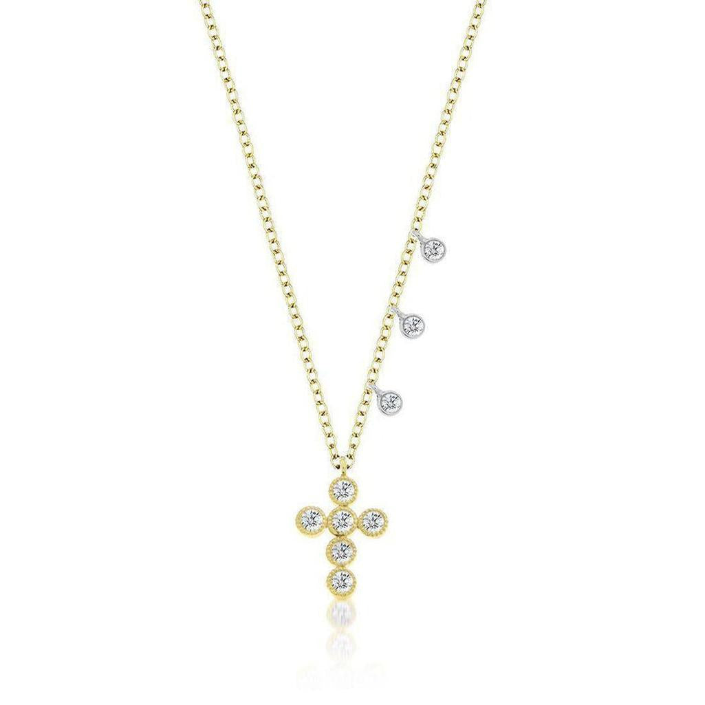 Yellow gold cross necklace with diamond accents and delicate charm drops.
