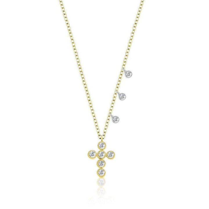 Yellow gold cross necklace with diamond accents and delicate charm drops.

