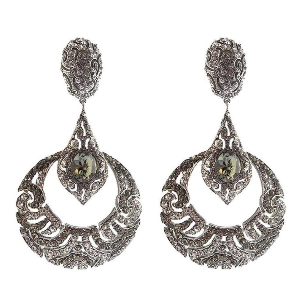 Crystal Black Diamond Deco Clip Earrings: Silver-tone, crystal-encrusted, statement earrings with large dark gray stones.
