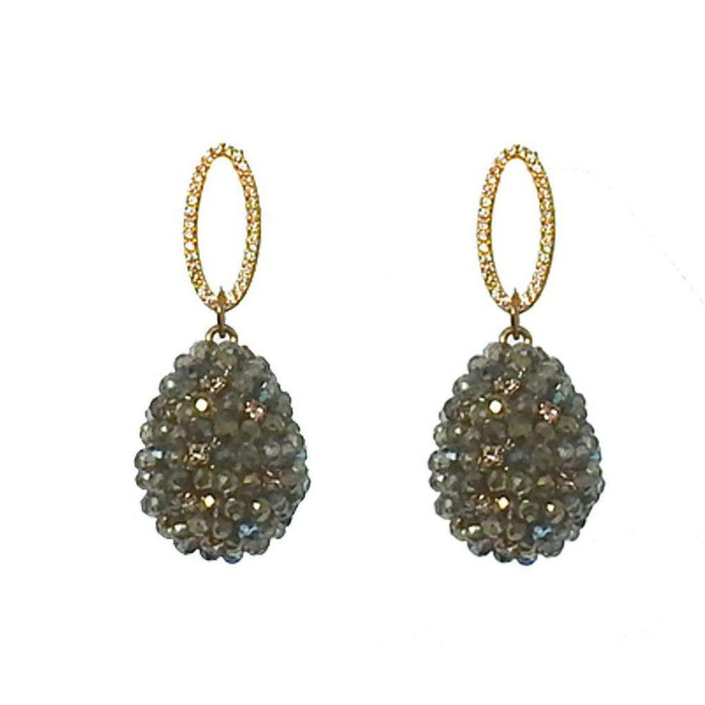 Green crystal drop earrings with gold oval accents.
