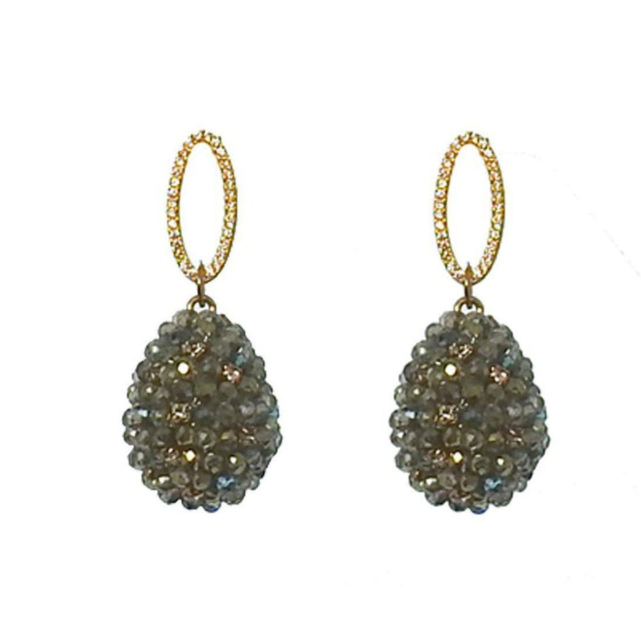 Green crystal drop earrings with gold oval accents.
