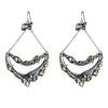 Silver crescent earrings with crystals and gold accents; statement jewelry.
